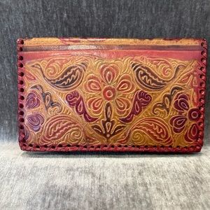Embossed genuine leather floral pattern wallet/clutch.